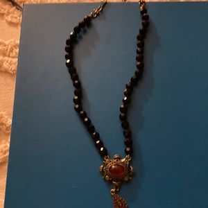 Beautiful Heidi Daus black beaded necklace with stone pendants - amber colored.